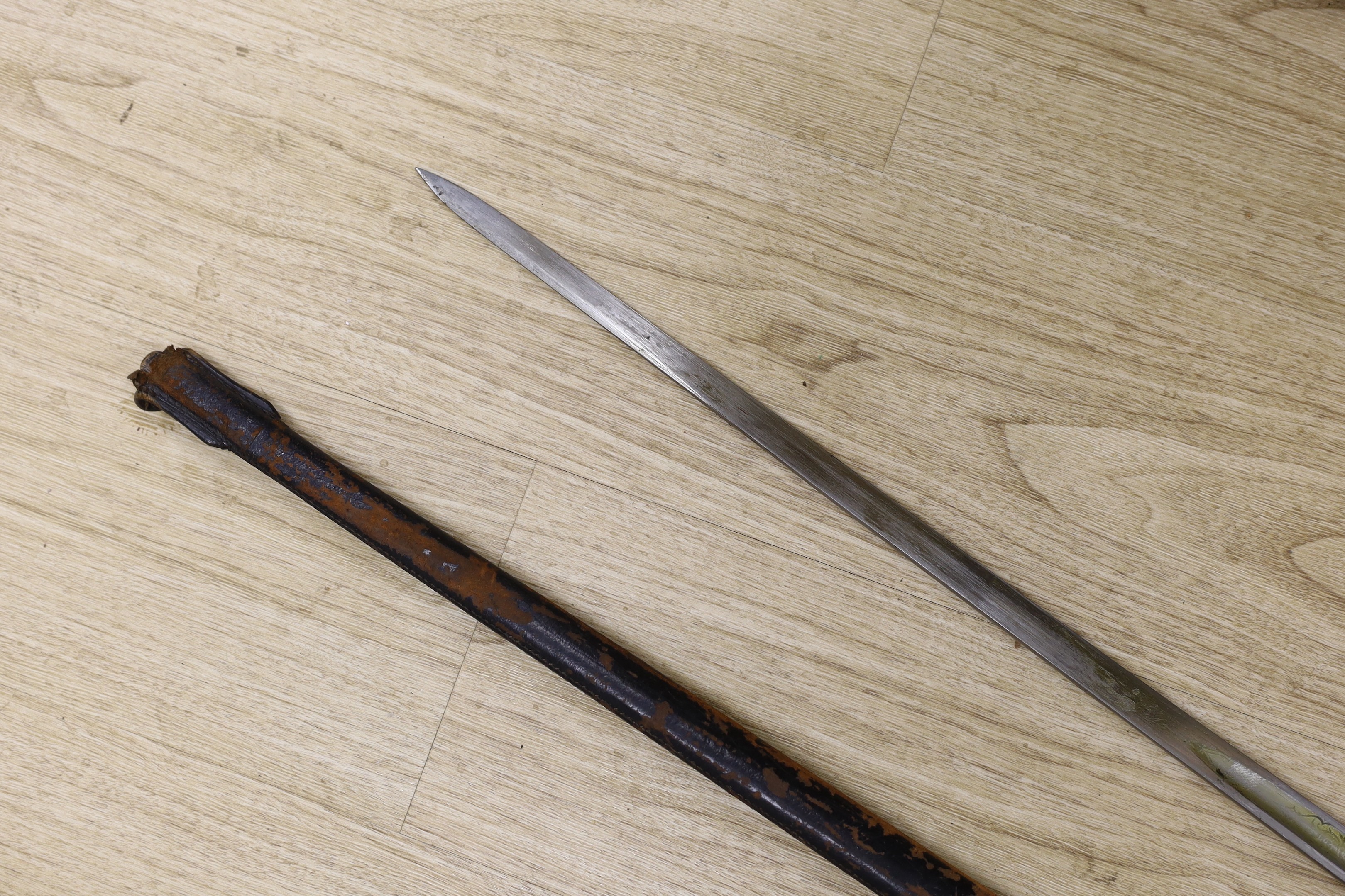 An officer's sword in fitted leather slip, overall length 100cm